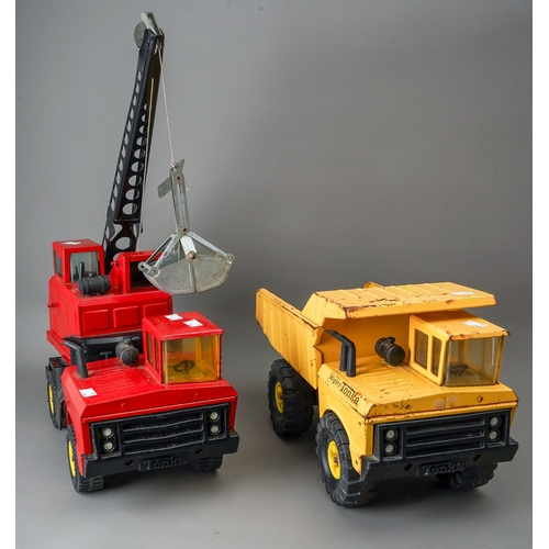 92 - Tonka Toys.  Large scale dumper truck and a 4 wheel crane truck in red with grab bucket (2)