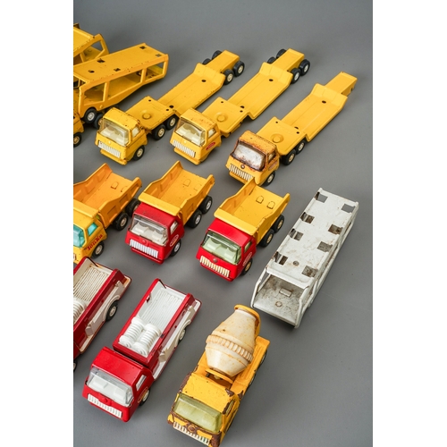 94 - Tonka Toys.  A tray of small scale vehicles to include 6 articulated car transporters, 6 flat bed tr... 