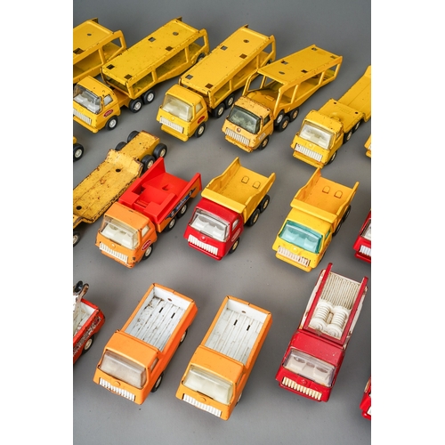 94 - Tonka Toys.  A tray of small scale vehicles to include 6 articulated car transporters, 6 flat bed tr... 