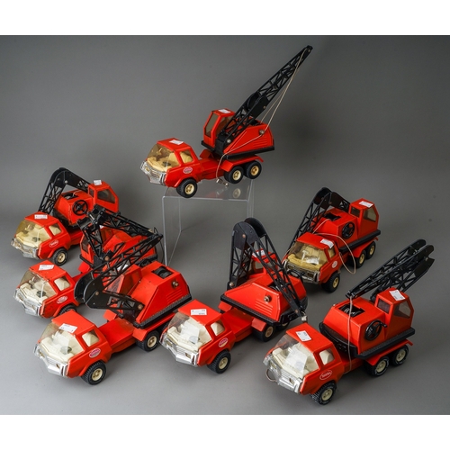 95 - Tonka Toys.  7 medium scale 6 wheel crane trucks in red, variable condition, some damaged (7)