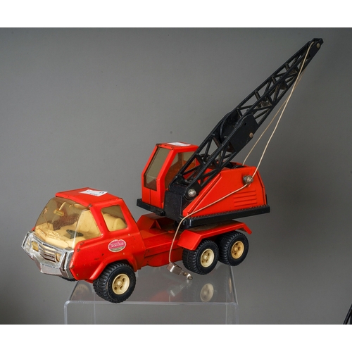 95 - Tonka Toys.  7 medium scale 6 wheel crane trucks in red, variable condition, some damaged (7)