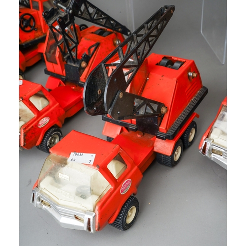 95 - Tonka Toys.  7 medium scale 6 wheel crane trucks in red, variable condition, some damaged (7)