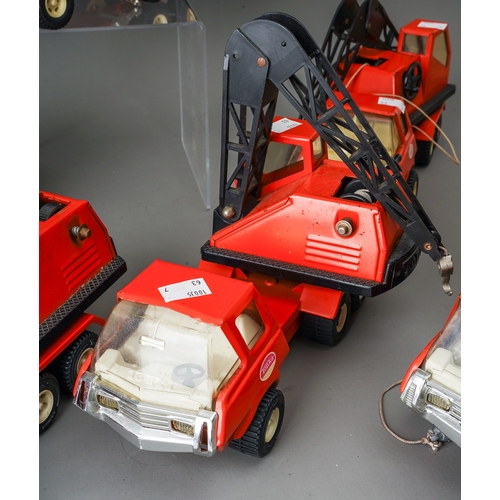 95 - Tonka Toys.  7 medium scale 6 wheel crane trucks in red, variable condition, some damaged (7)