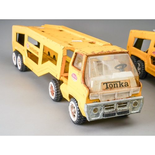 99 - Tonka Toys.  2 large scale articulated car transporters in yellow for restoration (2)