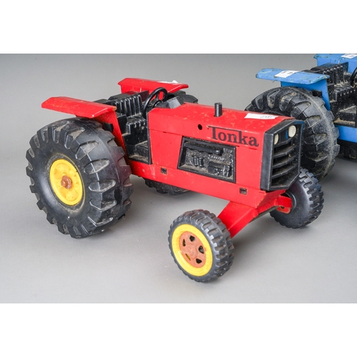 110 - Tonka Toys.  3 large scale tractors 2 red, 1 blue (3)