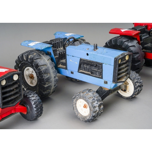 110 - Tonka Toys.  3 large scale tractors 2 red, 1 blue (3)