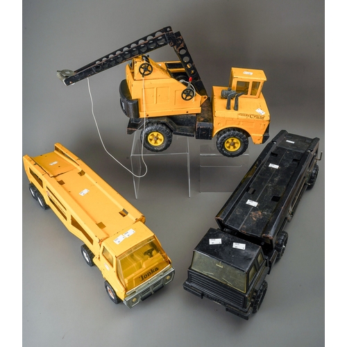 113 - Tonka Toys.  Two car carrier transporter articulated lorries (one black, one yellow) of medium size ... 