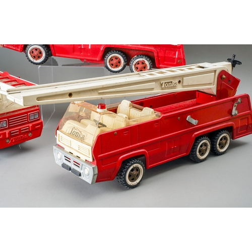 115 - Tonka Toys.  Three large size 6 wheel fire engines, some missing small parts (3)