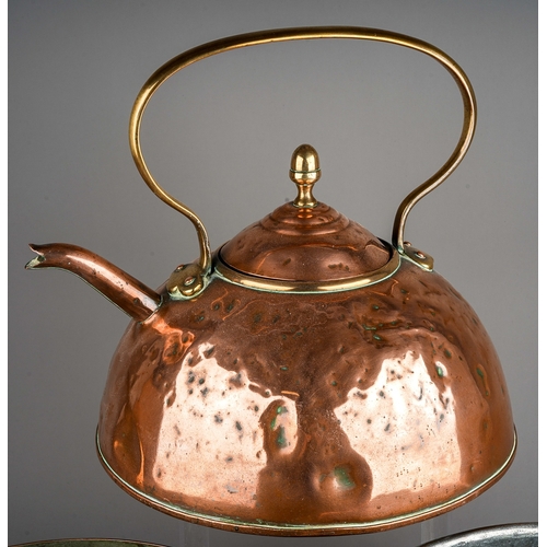 139 - A late 19th Century large copper kettle together two two large copper pans, one stamped 24