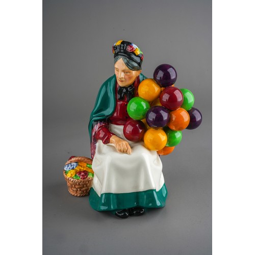 156 - An early 20th Century Royal Doulton figure of The Old Balloon Seller, HN1315, green factory stamp, n... 