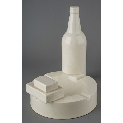 167 - Robin Levien - novelty cream ware pottery in the form of an ash tray, a bottle of beer, a cigarette ... 