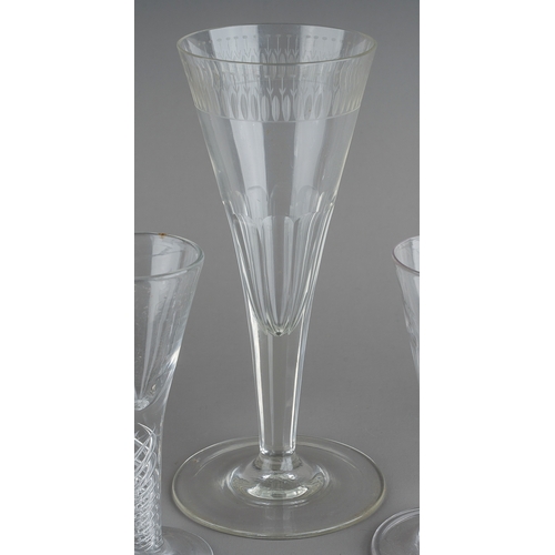 179 - A collection of clear glass drinking glasses probably 19th Century and later, all with trumpet shape... 