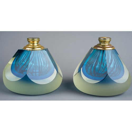 181 - A pair of vintage gilt mounted glass paperweights probably Murano, facet cut trapezoid with interior... 