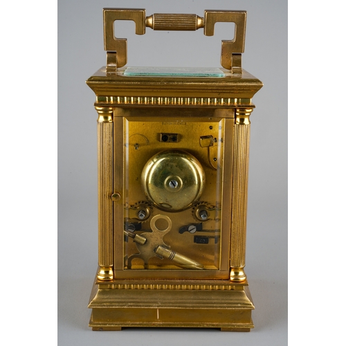 231 - An ormolu mounted four glass carriage clock, circular enamel dial with Roman Numerals and numbered D... 