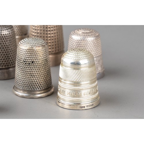 15 - A collection of 16 silver thimbles, various sizes and dates