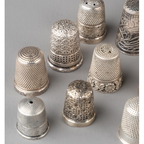 15 - A collection of 16 silver thimbles, various sizes and dates