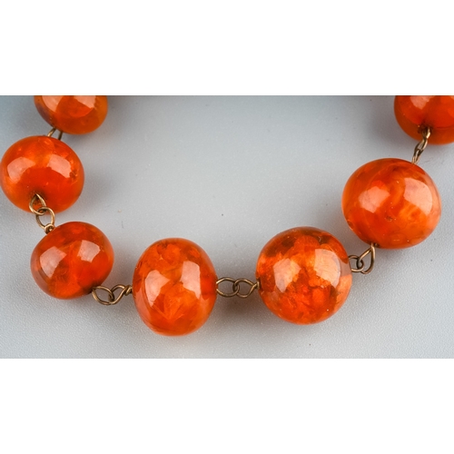 7 - A graduated amber bead necklace, 46cm long, total gross weight approx 22g