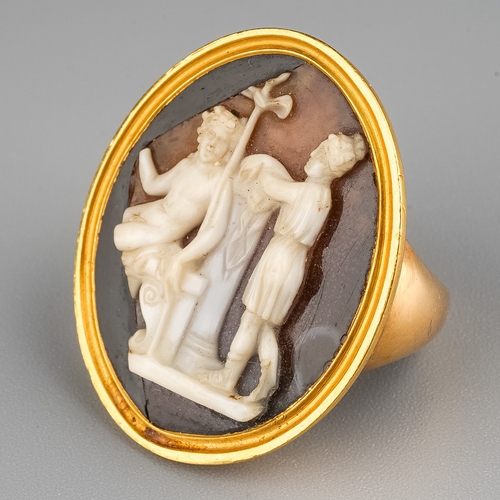 8 - A 19th century yellow gold and cameo ring, the 26mm x 21mm hardstone cameo carved depicting classica... 