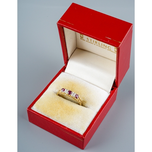 11 - A 9ct yellow gold ruby and diamond ring, set with three round-cut rubies with diamond-chip spacers, ... 