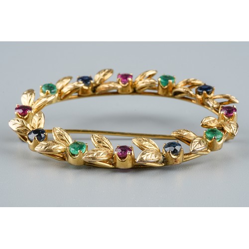 32 - A yellow gold and gem-set oval brooch, set with rubies, emeralds and sapphires, approx 4.5cm wide, u... 