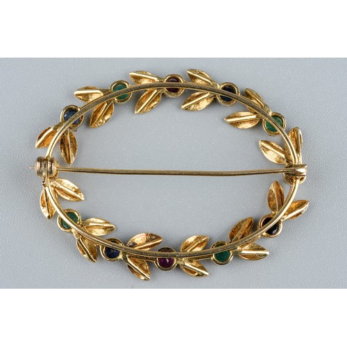 32 - A yellow gold and gem-set oval brooch, set with rubies, emeralds and sapphires, approx 4.5cm wide, u... 