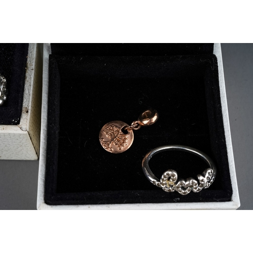 61 - A collection of silver jewellery, including two Pandora bracelets, rings, silver and CZ rings, gold-... 