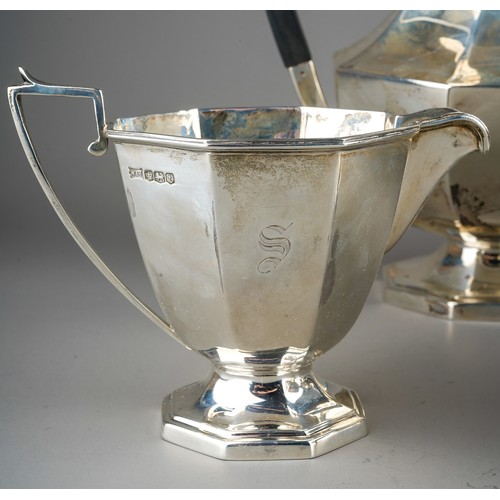 203 - A George VI silver four piece tea service comprising teapot, milk jug, sugar bowl and hot water pot,... 