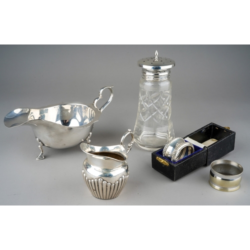 221 - Assorted silver table ware to include: Georgian style sauceboat, by AJZ, Birmingham, 1911; Victorian... 