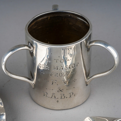 227 - A group of silver to include: an Edwardian three handled tot / tig, engraved inscription, hallmarked... 