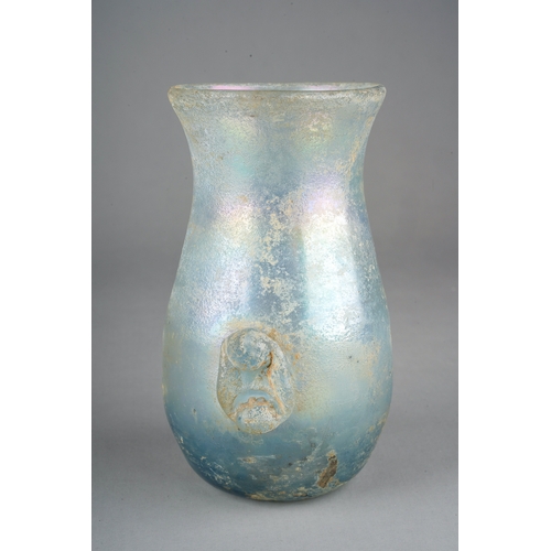 101 - A Roman iridescent glass vase with applied lower section handles, approx 12cm high