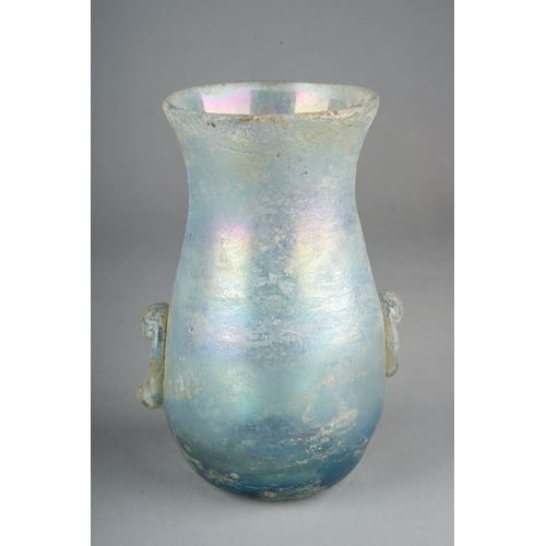 101 - A Roman iridescent glass vase with applied lower section handles, approx 12cm high