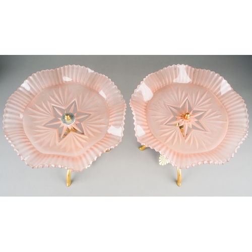 102 - A pair of Art Nouveau style brass and opaline glass comports, pink wavy glass above cast stands with... 