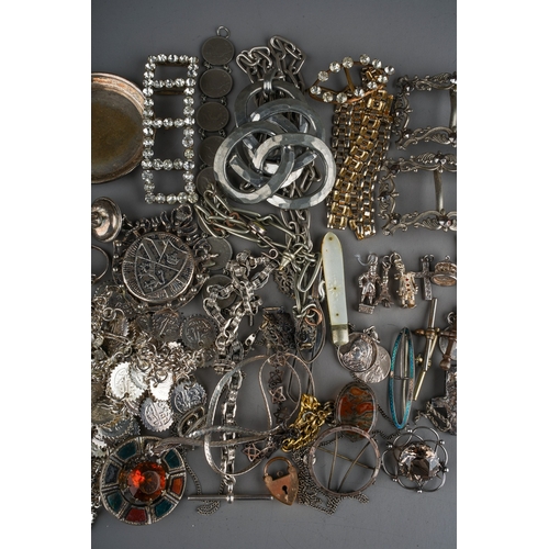 111 - A collection of silver and white metal jewellery, including chains, watch chains, brooches, pendants... 