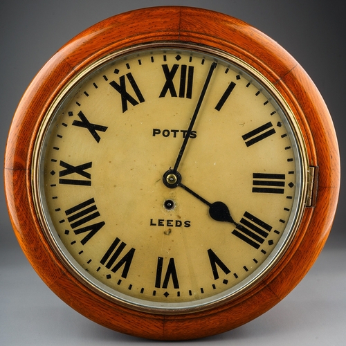 272 - Wall Clock by Potts of Leeds in a wooden mahogany case,  with Roman numerals on the dial.