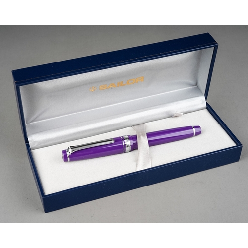 359 - A group of three Japanese Sailor fountain pens in yellow, purple or red, all with 14k white or yello... 