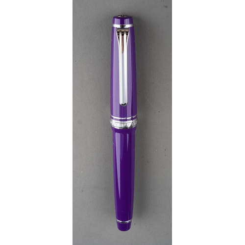 359 - A group of three Japanese Sailor fountain pens in yellow, purple or red, all with 14k white or yello... 