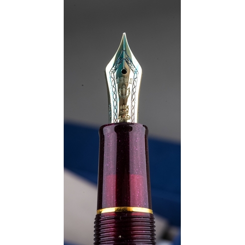 361 - Two Japanese Sailor fountain pens both with 14k gold nibs stamped 14K 585 bodies in purple and gilt ... 