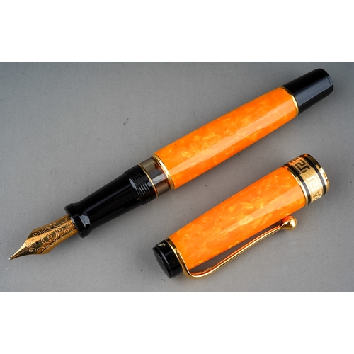 363 - An Italian Aurora amber marbled fountain pen with 18Kt gold nib, stamped 18K 750, the cover with Gre... 