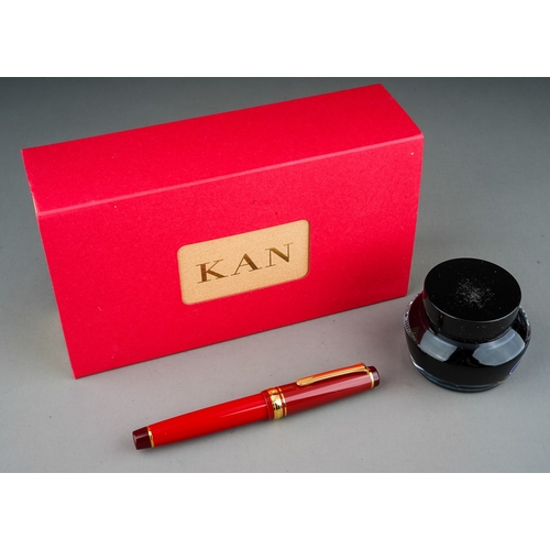 365 - A Japanese Sailor red and gilt fountain pen with 21k Naginata Togi nib, stamped 21K 875, boxed with ...