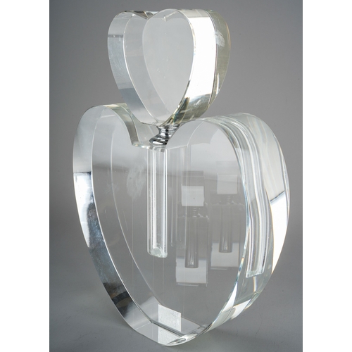 529 - A collection of three various glass scent bottles to include large heart shaped, small heart shaped ... 