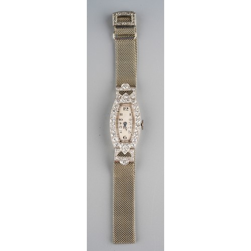 47 - A ladies Art Deco diamond set cocktail watch, the shaped rectangular dial with Arabic numerals, the ... 