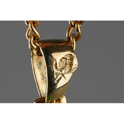 51 - A 9ct yellow gold and mother of pearl pendant, on a 9ct gold chain, total gross weight approx 12.2g