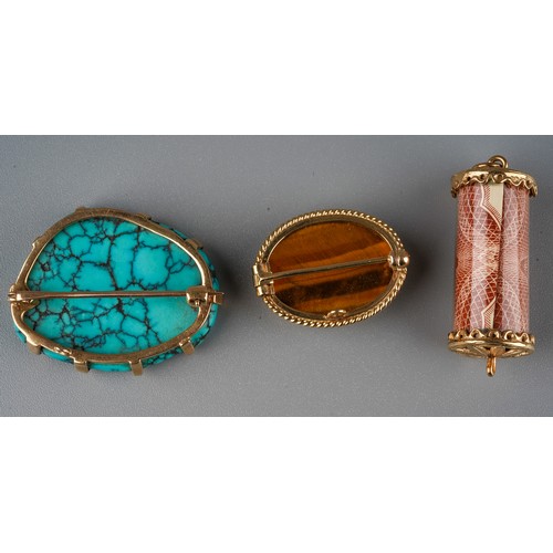 53 - A 9ct gold and tiger's eye oval brooch, set with an oval cabochon stone within a gold border, approx... 