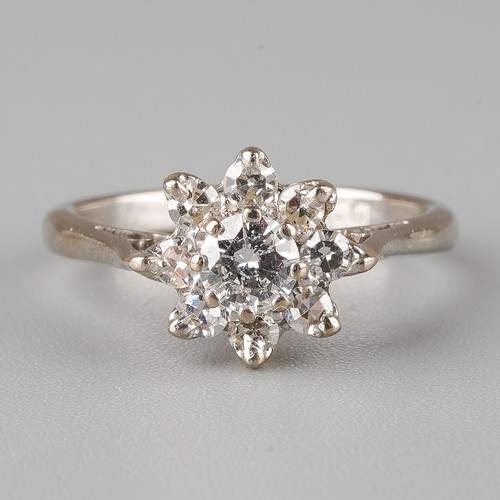 56 - An 18ct white gold and diamond cluster ring, set with a round brilliant-cut diamond approx 0.2ct, su... 