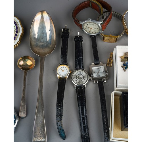 62 - A collection of costume jewellery, including a silver bangle, beads, necklaces, brooches, earrings, ... 