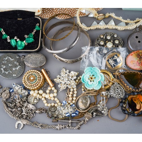 63 - A collection of jewellery, including silver bangles, watch chain, charm bracelet, filigree necklace,... 