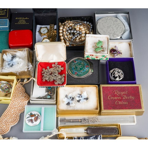 63 - A collection of jewellery, including silver bangles, watch chain, charm bracelet, filigree necklace,... 