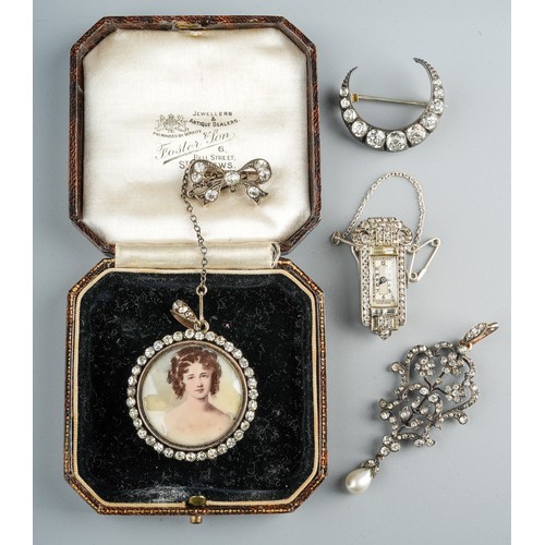 69 - A 19th century foliate pendant, set with paste stones and a pearl drop, silver settings on yellow me... 