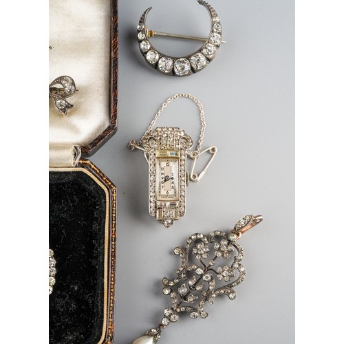 69 - A 19th century foliate pendant, set with paste stones and a pearl drop, silver settings on yellow me... 