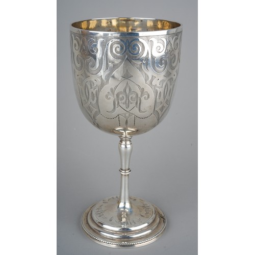 211 - A Victorian silver goblet, engraved scrolling detail, vacant cartouche, on a stepped circular base, ... 